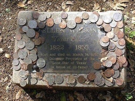 Coins on headstone_The Wild Geese Photo Credit