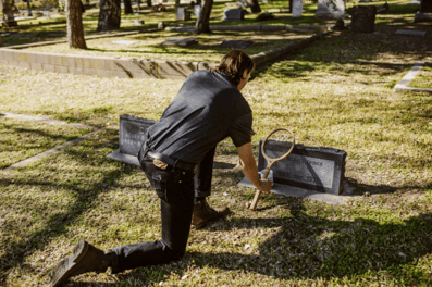 Man visiting grave