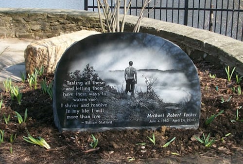 memorial headstone with nature etching