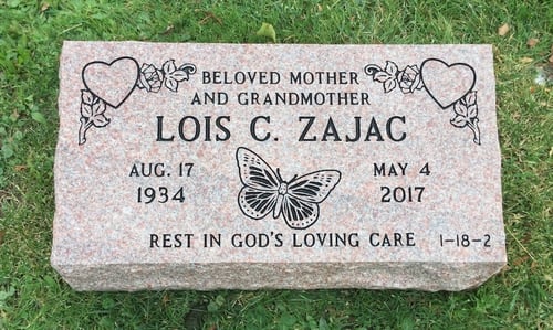 bevel headstone with engraved symbols