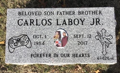lawn level headstone with engraved video game controller