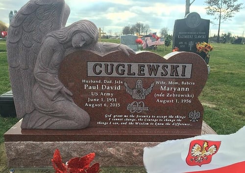 upright headstone with angel carving