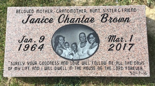 lawn level headstone with engraved quote